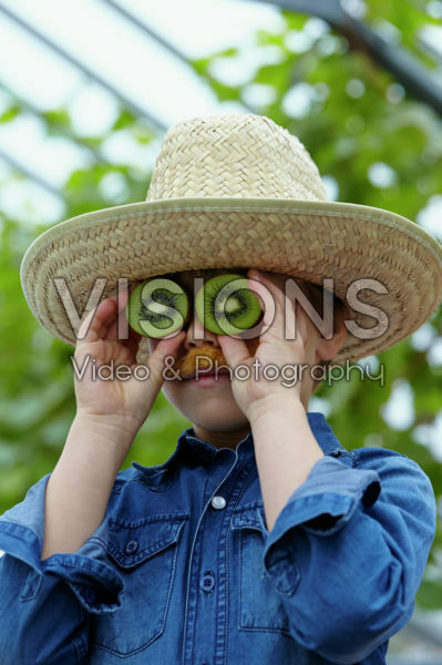 Boy with kiwi fruit Boy with kiwi fruit