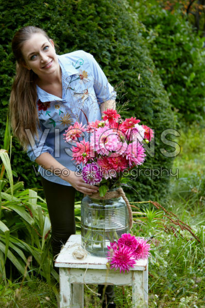 Lady making Dahlia bouquet Lady making Dahlia bouquet