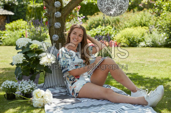 Lady relaxing under tree Lady relaxing under tree