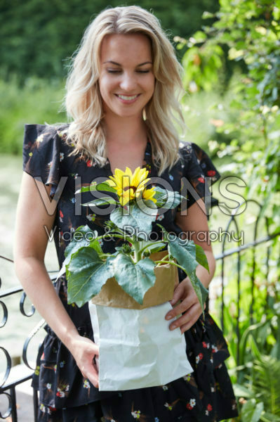 Lady holding sunflower Lady holding sunflower
