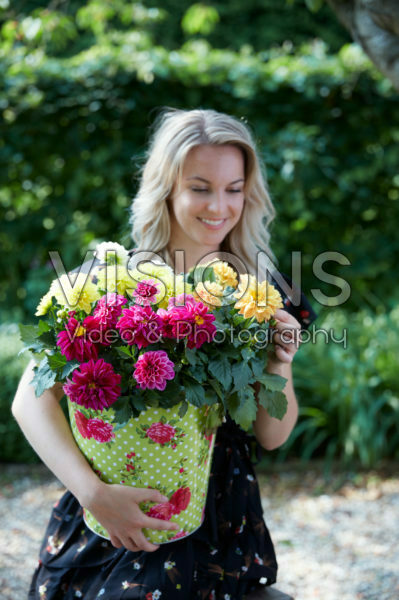 Lady holding dahlias Lady holding dahlias