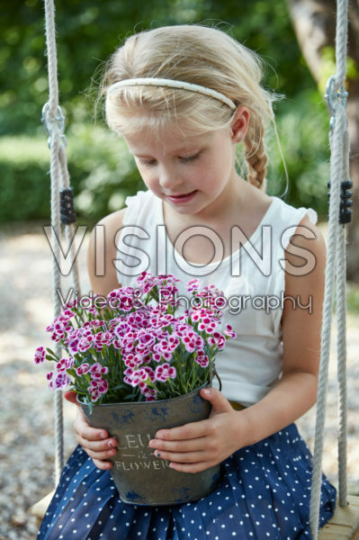Girl holding dianthus Girl holding dianthus
