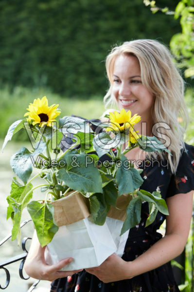 Lady holding sunflowers Lady holding sunflowers