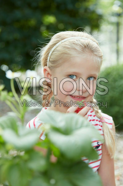 Girl eating strawberry Girl eating strawberry