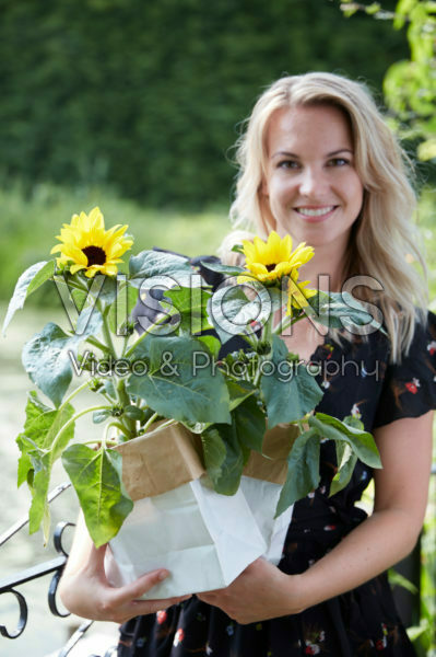 Lady holding sunflowers Lady holding sunflowers