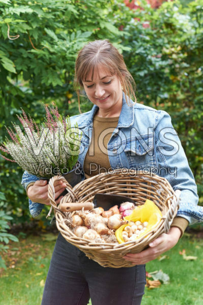 Young lady with flower bulbs Young lady with flower bulbs