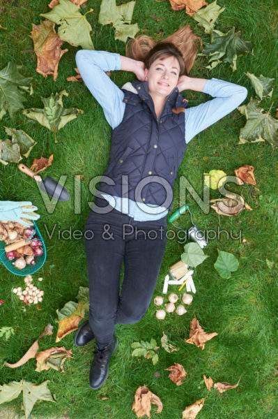 young lady lying in the grass young lady lying in the grass
