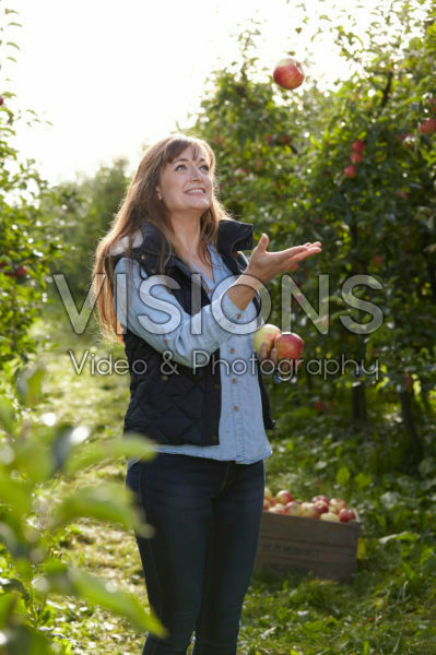 Young lady in apple orchard Young lady in apple orchard