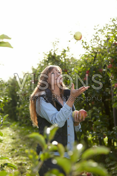 Young lady in apple orchard Young lady in apple orchard