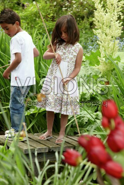 Children fishing in garden Children fishing in garden