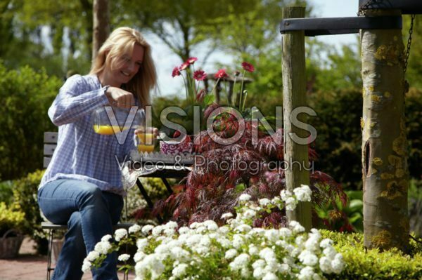 Woman relaxing in garden Woman relaxing in garden