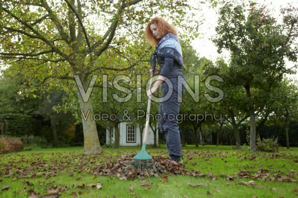 Woman raking leaves Woman raking leaves