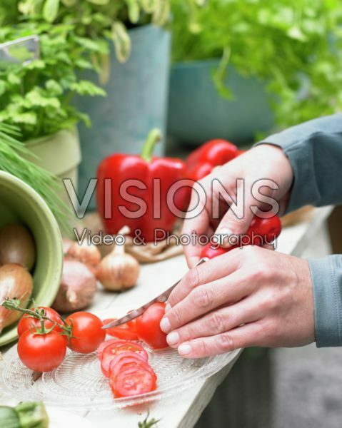 Slicing tomatoes Slicing tomatoes