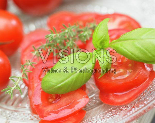 Fresh basil on tomatoes Fresh basil on tomatoes